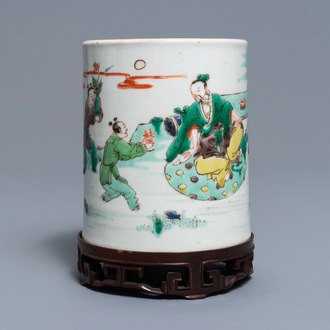 A Chinese famille verte brush pot on wooden stand, Kangxi